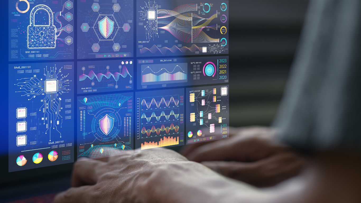 A wall of compliance and risk dashboards lit by an operator’s hands on a keyboard — the supervisory telemetry the Wersel Stack emits as a side effect of running.